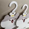 Recyclable cardboard clothes hanger for the Liby brand in the shape of a cat. Made of environmentally friendly, renewable and degradable cardboard, used for clothing terminal advertising displays in supermarkets