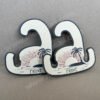 A flip-flop hook with the NEXT brand printed on it, made of cute colorful paper products and high-hardness recycled cardboard. It has a load-bearing capacity of about 4KG. It is biodegradable and recyclable after use, and is eco-friendly.